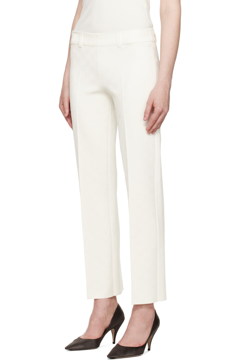 Viscose-blend jersey trousers. Jacquard check pattern throughout.

· Belt loops at rib-knit waistband
· Pinched seam at legs
· Mock pockets at back

Part of the exclusive SSENSE Bridal capsule.

Supplier color: Ivory