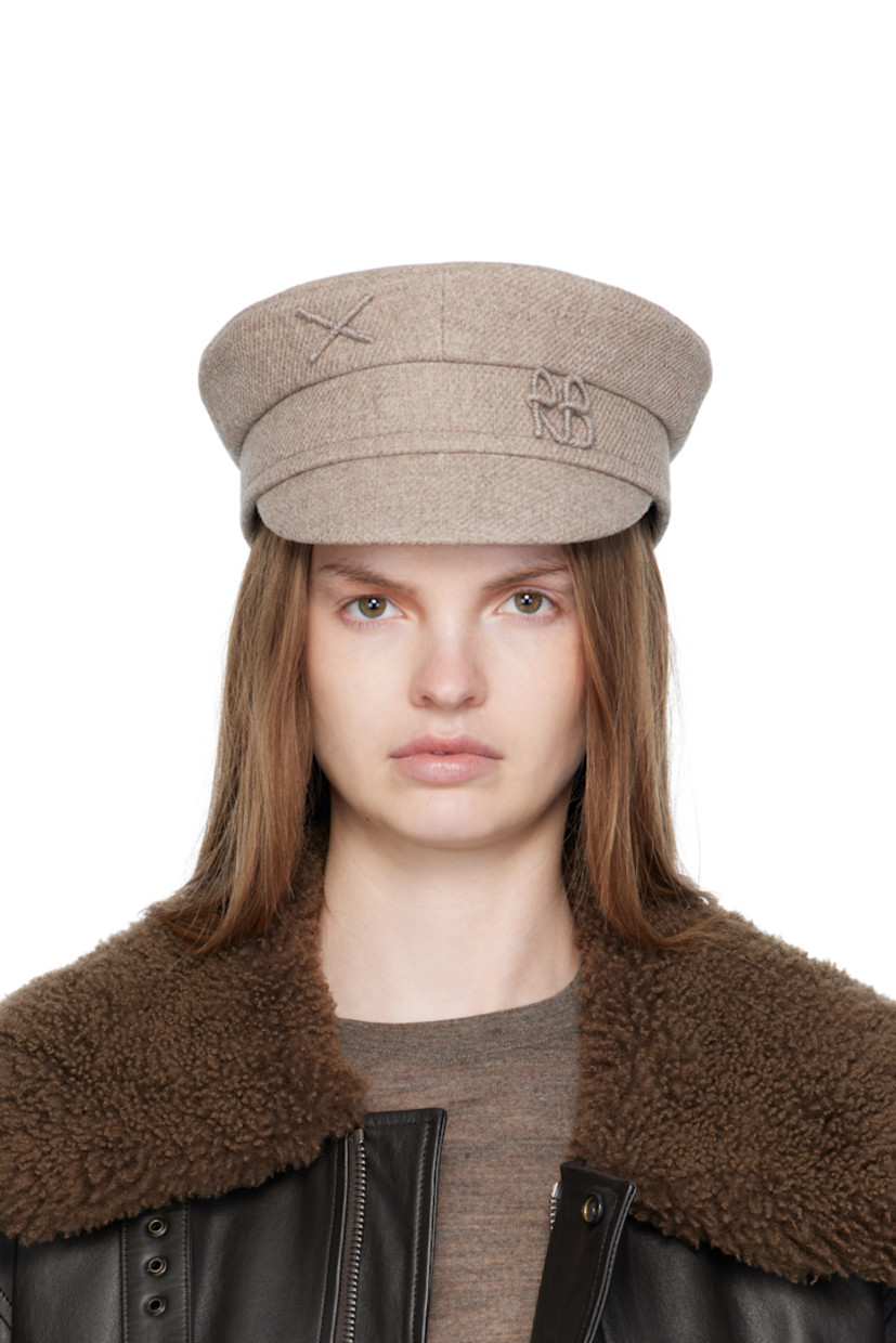 Handcrafted wool-blend tweed cap.

· Graphic and logo appliqué at face 
· Curved brim
· Cotton twill lining

Supplier color: Beige