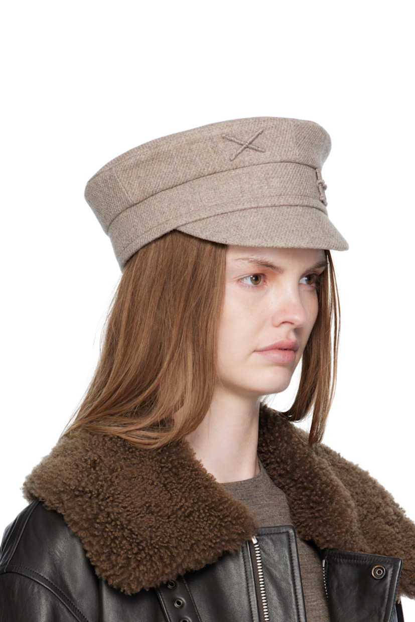 Handcrafted wool-blend tweed cap.

· Graphic and logo appliqué at face 
· Curved brim
· Cotton twill lining

Supplier color: Beige
