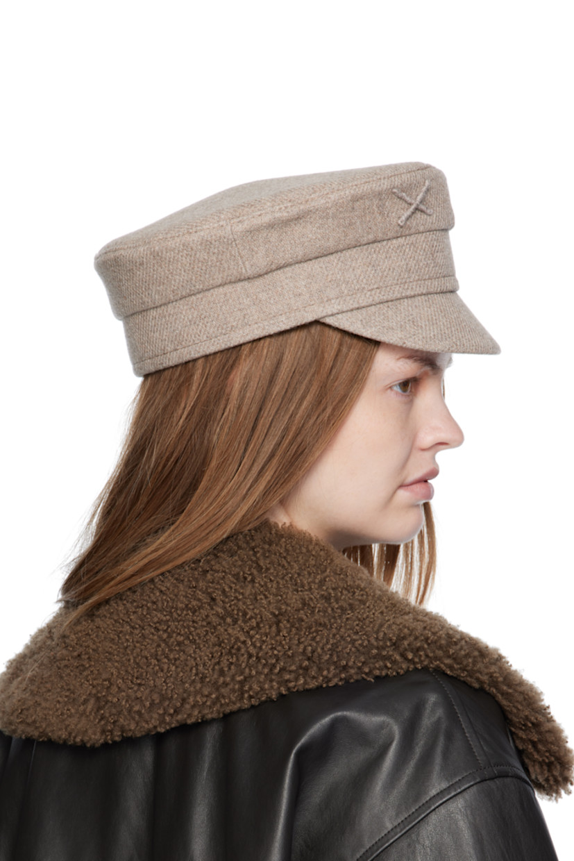 Handcrafted wool-blend tweed cap.

· Graphic and logo appliqué at face 
· Curved brim
· Cotton twill lining

Supplier color: Beige