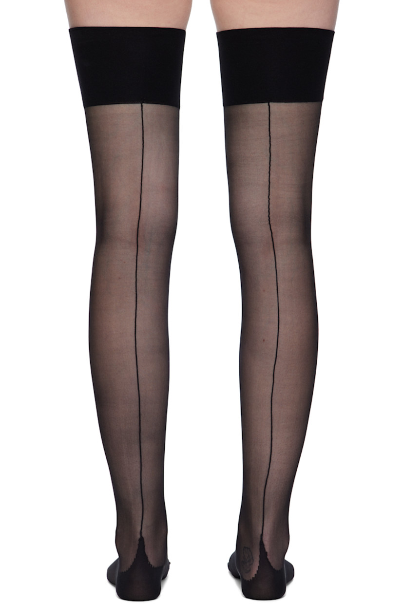 Pair of sheer stretch nylon socks.

· Thigh-high
· 15 denier nylon
· Lightweight rib-knit cuffs
· Central seam at back
· Reinforced toe and heel

Supplier color: Black