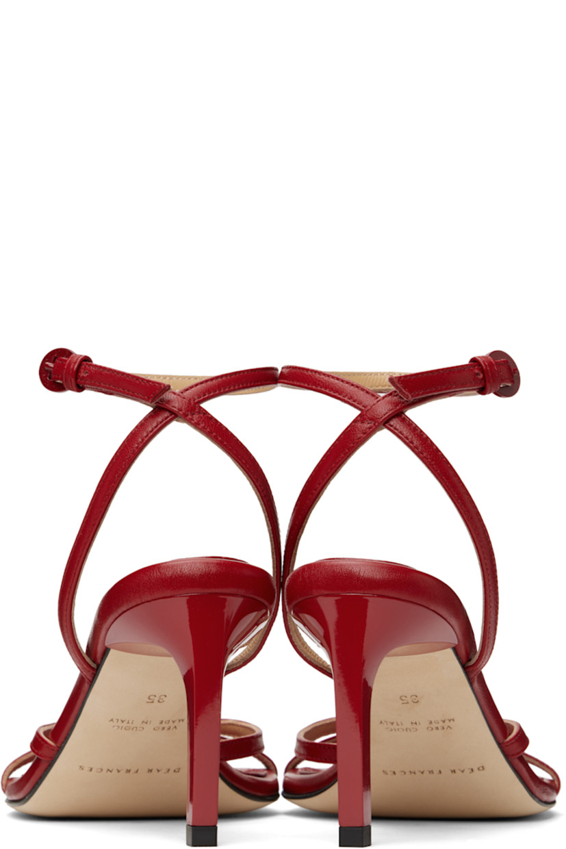 Buffed leather heeled sandals in red.

· Open square toe
· Pin-buckle ankle strap
· Logo embossed at padded leather footbed
· Stiletto heel with rubber injection
· Nubuck sole
· Heel: H2.75"

Supplier color: Red