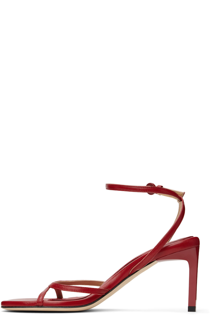 Buffed leather heeled sandals in red.

· Open square toe
· Pin-buckle ankle strap
· Logo embossed at padded leather footbed
· Stiletto heel with rubber injection
· Nubuck sole
· Heel: H2.75"

Supplier color: Red