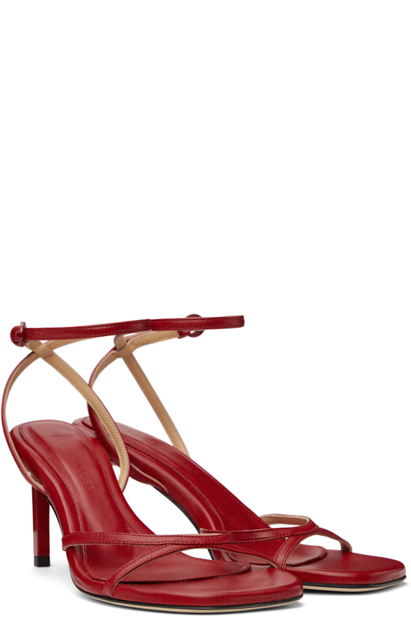 Buffed leather heeled sandals in red.

· Open square toe
· Pin-buckle ankle strap
· Logo embossed at padded leather footbed
· Stiletto heel with rubber injection
· Nubuck sole
· Heel: H2.75"

Supplier color: Red