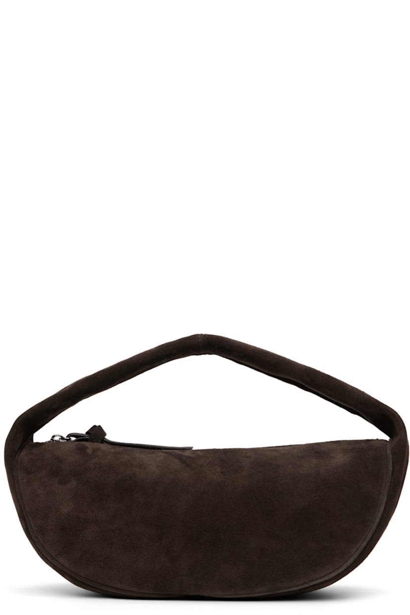 Suede top handle bag.

· Integrated shoulder strap
· Zip closure
· Microfiber lining
· H6" x W12.5" x D5"

Supplier color: Ristretto