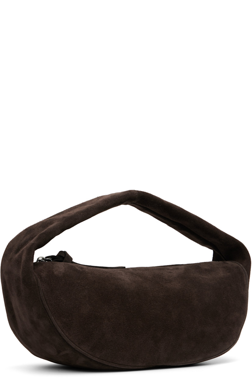 Suede top handle bag.

· Integrated shoulder strap
· Zip closure
· Microfiber lining
· H6" x W12.5" x D5"

Supplier color: Ristretto
