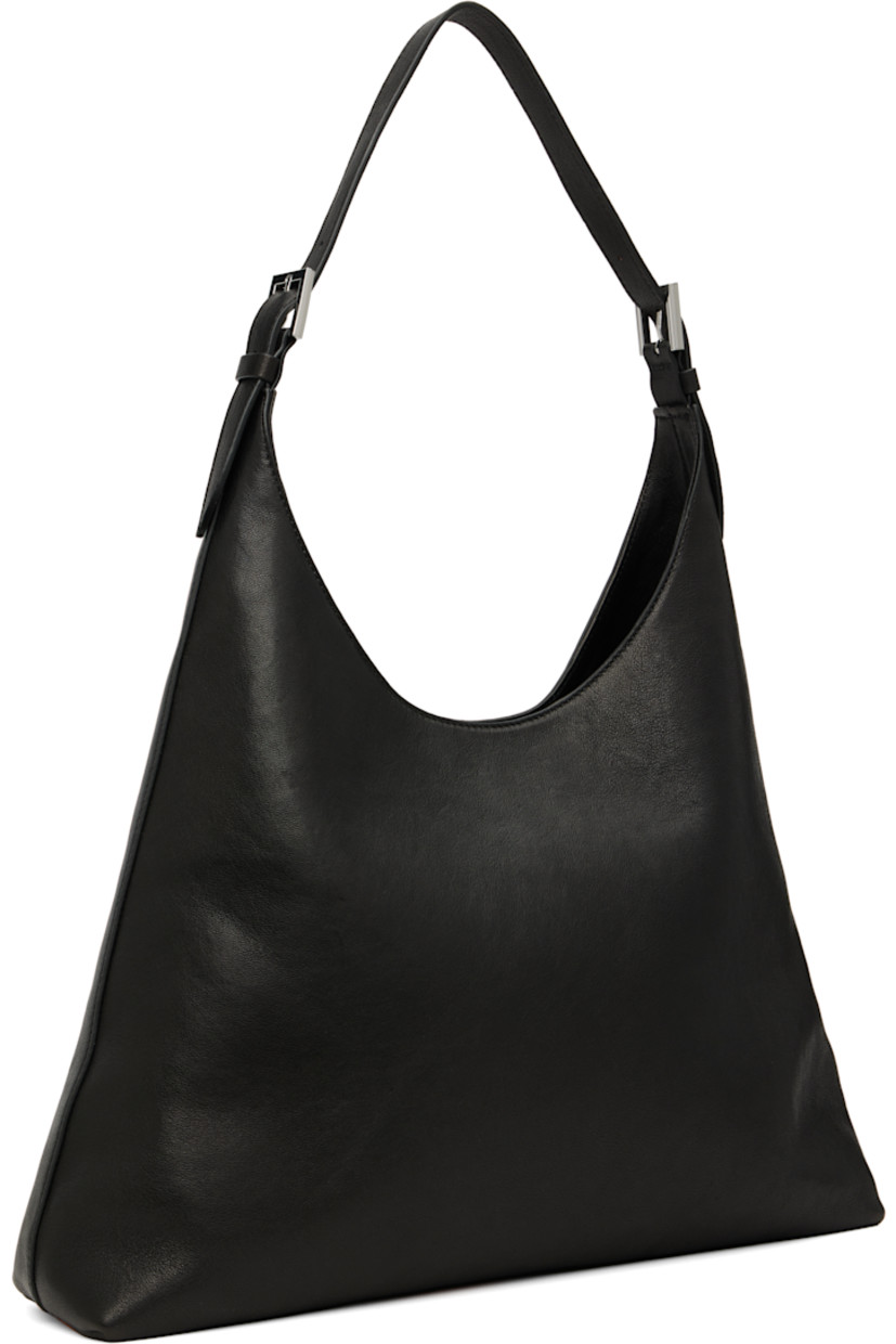 Grained lambskin shoulder bag.

· Adjustable shoulder strap
· Magnetic closure
· Patch pocket at interior
· Faux-suede lining
· H10" x W15" x D3.75"

Supplier color: Black