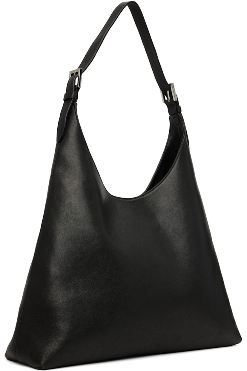 Grained lambskin shoulder bag.

· Adjustable shoulder strap
· Magnetic closure
· Patch pocket at interior
· Faux-suede lining
· H10" x W15" x D3.75"

Supplier color: Black