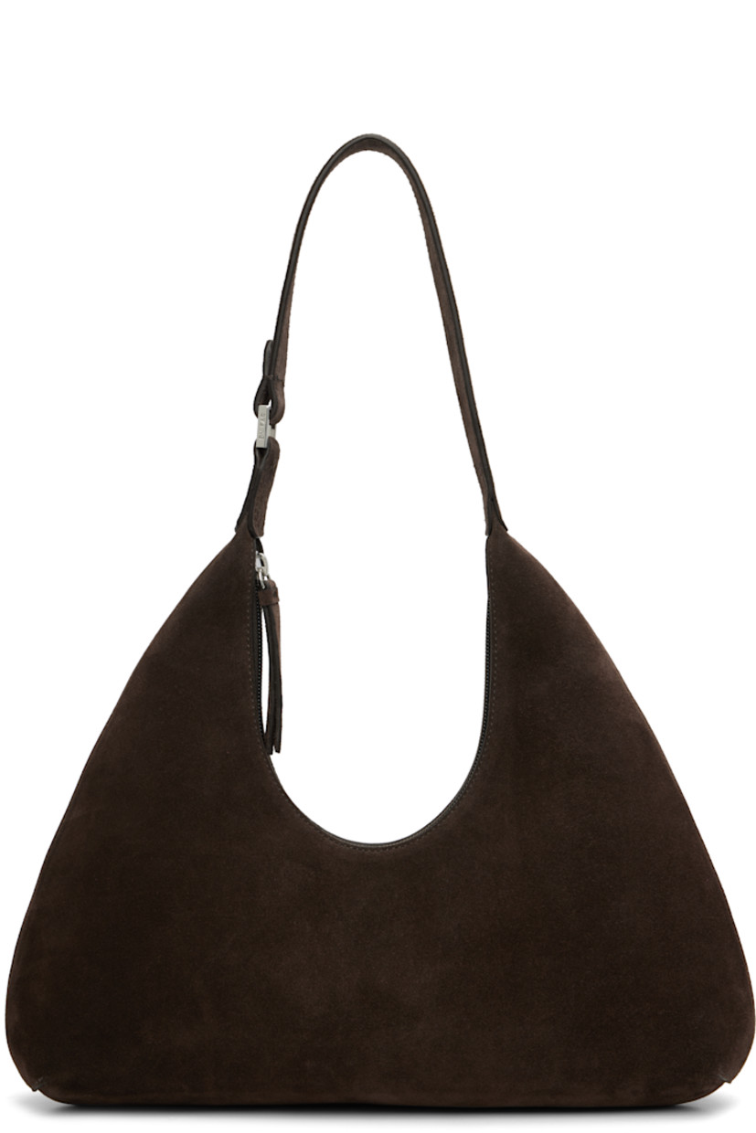 Suede shoulder bag.

· Fixed shoulder strap
· Zip closure
· Patch pockets at interior
· Faux-suede lining
· Logo-engraved silver-tone hardware
· H11.75" x W12" x D3.25"

Supplier color: Ristretto