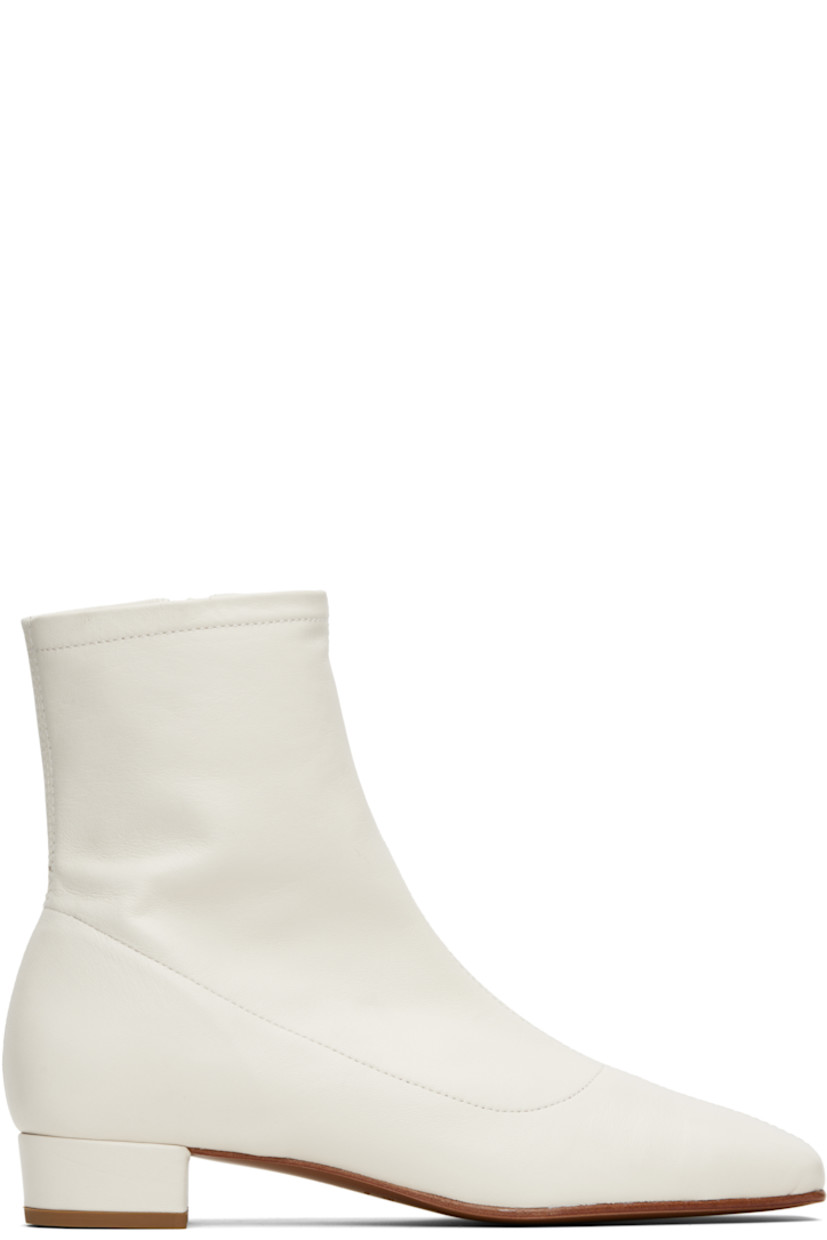 Ankle-high grained lambskin boots.

· LWG-certified lambskin
· Square toe
· Zip closure at inner side
· Covered block heel with rubber injection
· Nubuck sole
· Heel: H1"

Supplier color: White