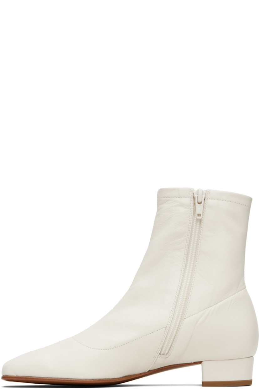 Ankle-high grained lambskin boots.

· LWG-certified lambskin
· Square toe
· Zip closure at inner side
· Covered block heel with rubber injection
· Nubuck sole
· Heel: H1"

Supplier color: White