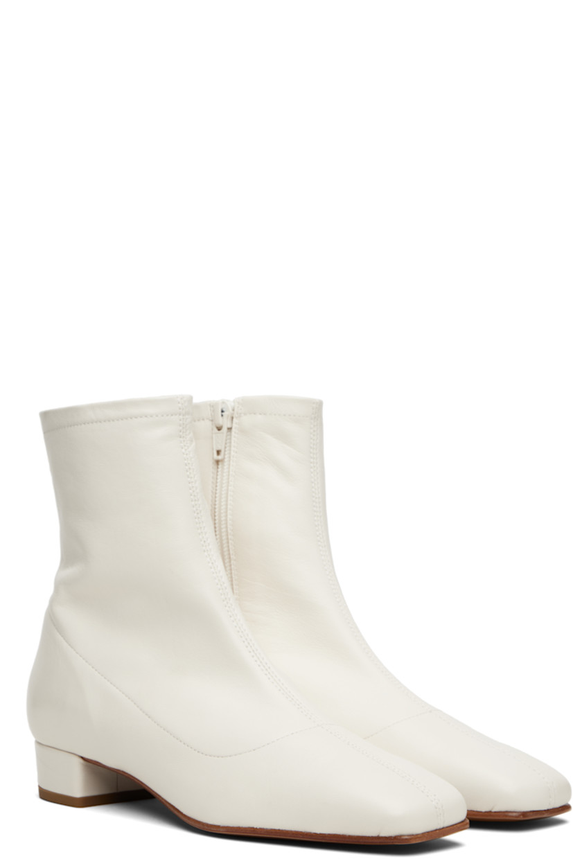 Ankle-high grained lambskin boots.

· LWG-certified lambskin
· Square toe
· Zip closure at inner side
· Covered block heel with rubber injection
· Nubuck sole
· Heel: H1"

Supplier color: White