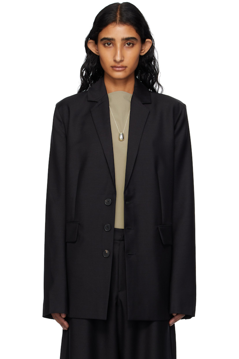 Plain-woven mohair- and wool-blend blazer. 

· Notched lapel
· Button closure
· Darts at front
· Flap pockets
· Surgeon's cuffs 
· Central vent at back hem
· Welt pockets at interior
· Full silk charmeuse lining 
· Horn hardware

Supplier color: Black