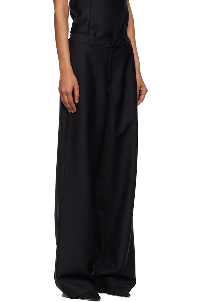 Plain-woven mohair- and wool-blend trousers. 

· Loose-fit
· Mid-rise
· Belt loops
· Three-pocket styling
· Zip fly
· Darts at front and back

Supplier color: Black