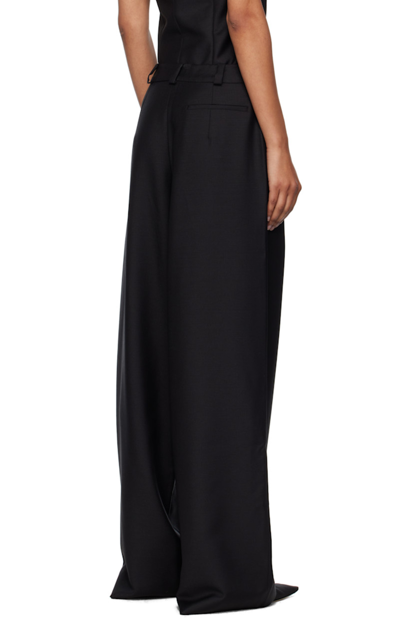 Plain-woven mohair- and wool-blend trousers. 

· Loose-fit
· Mid-rise
· Belt loops
· Three-pocket styling
· Zip fly
· Darts at front and back

Supplier color: Black