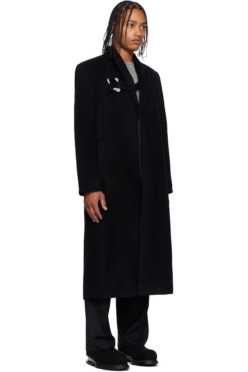 Wool- and cashmere-blend melton coat. 

· Shawl collar 
· Concealed button closure
· Harness-style strap with carabiner at chest 
· Welt pockets at waist 
· Padded shoulders
· Press-stud fastening at cuffs
· Central vent at back hem 
· Welt pocket at interior 
· Full recycled satin lining 

Supplier color: Black