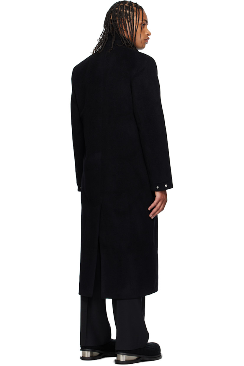 Wool- and cashmere-blend melton coat. 

· Shawl collar 
· Concealed button closure
· Harness-style strap with carabiner at chest 
· Welt pockets at waist 
· Padded shoulders
· Press-stud fastening at cuffs
· Central vent at back hem 
· Welt pocket at interior 
· Full recycled satin lining 

Supplier color: Black