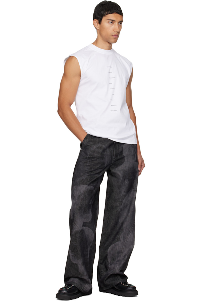 Oil-washed non-stretch denim jeans.

· Garment-dyed
· Laser-engraved graphics throughout 
· Wide-leg 
· Belt loops
· Four-pocket styling
· Zip fly 
· Logo-engraved carabiner at front waist

Supplier color: Black