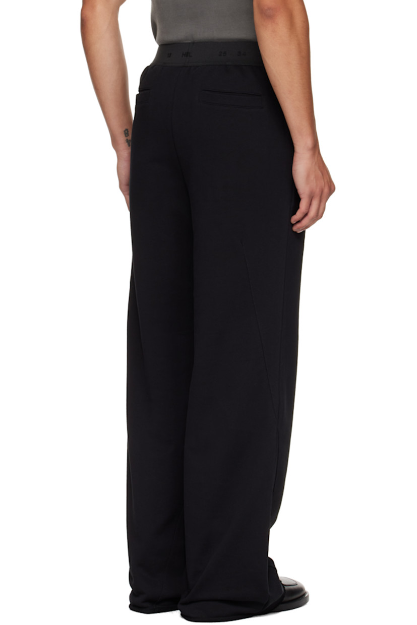 French terry sweatpants.

· Loose-fit
· Jacquard logo at elasticized waistband
· Four-pocket styling
· Raw edge at cuffs

Supplier color: Black