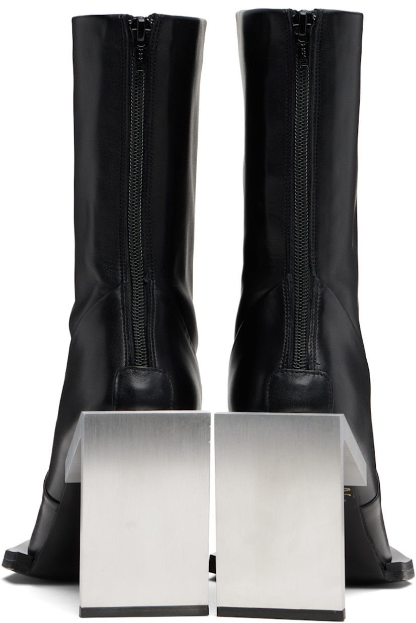 Handcrafted ankle-high buffed calfskin boots.

· Logo plaque at square toe
· Zip closure at heel 
· Bonded jersey lining
· Brushed stainless steel heel with rubber injection
· Leather sole
· Heel: H4" 

Supplier color: Black