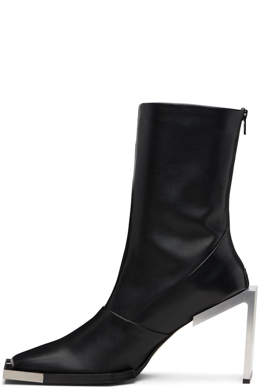 Handcrafted ankle-high buffed calfskin boots.

· Logo plaque at square toe
· Zip closure at heel 
· Bonded jersey lining
· Brushed stainless steel heel with rubber injection
· Leather sole
· Heel: H4" 

Supplier color: Black