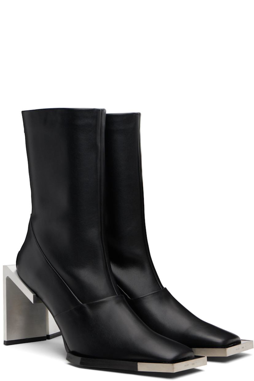 Handcrafted ankle-high buffed calfskin boots.

· Logo plaque at square toe
· Zip closure at heel 
· Bonded jersey lining
· Brushed stainless steel heel with rubber injection
· Leather sole
· Heel: H4" 

Supplier color: Black