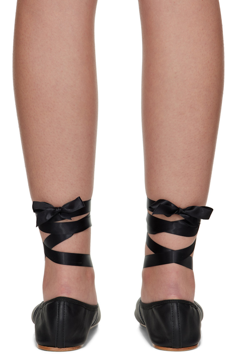 Grained nappa calfskin ballerina flats.

· Bow accent and grosgrain trim at collar
· Wraparound self-tie satin ankle straps
· Cotton twill lining
· Leather sole

Supplier color: Black
