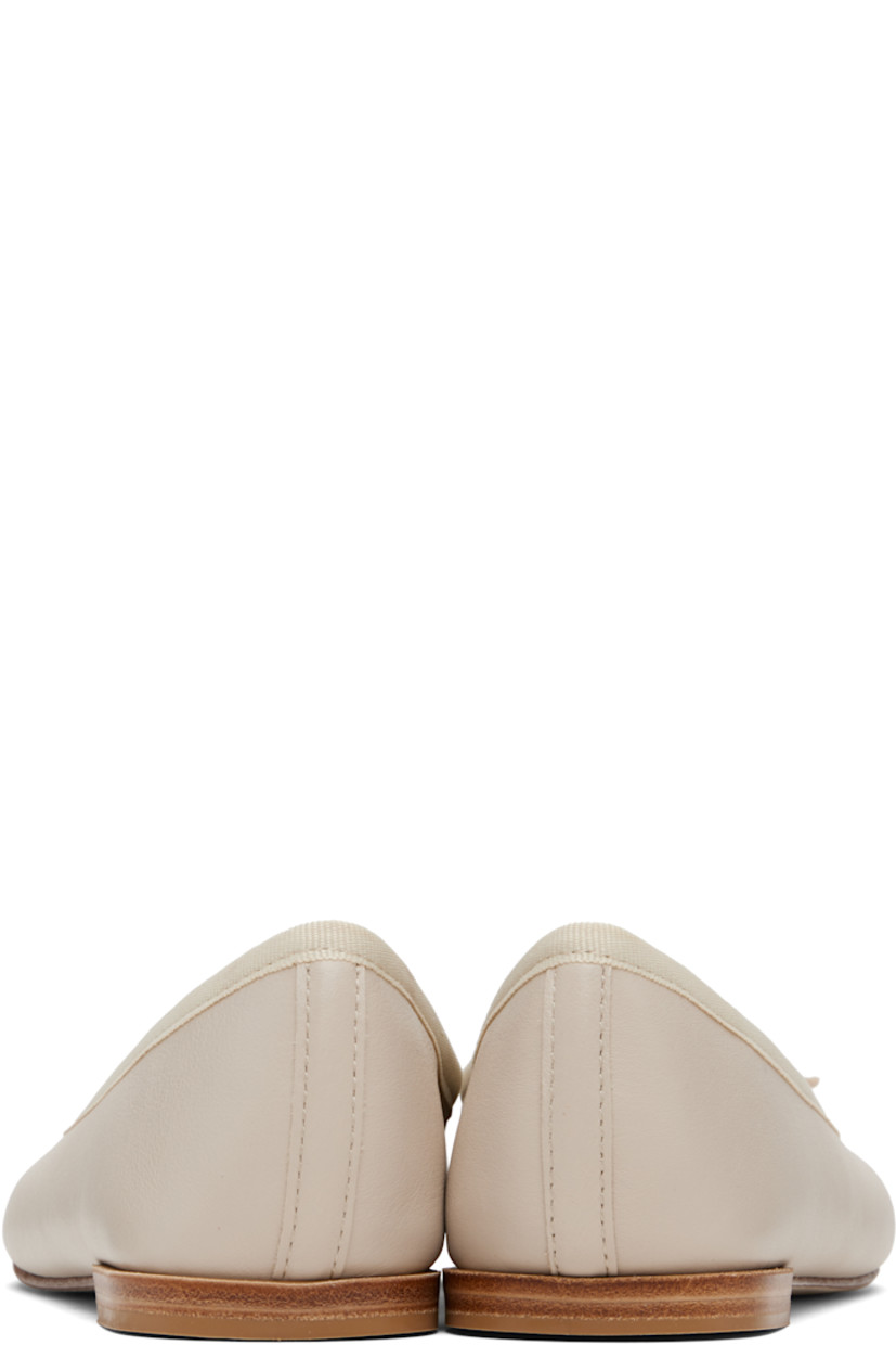 Grained nappa calfskin ballerina flats.

· Bow accent at vamp
· Grosgrain trim at collar
· Twill lining
· Stacked leather heel with rubber injection
· Leather sole

Supplier color: Swan beige