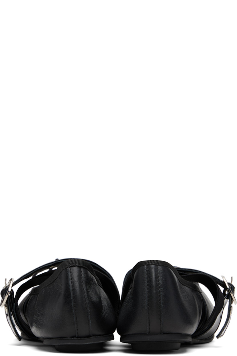 Buffed and patent leather ballerina flats.

· Bow accent and grosgrain trim at collar
· Pin-buckle and elasticized crisscrossing straps at vamp
· Cotton twill lining
· Rubber sole

Supplier color: Black