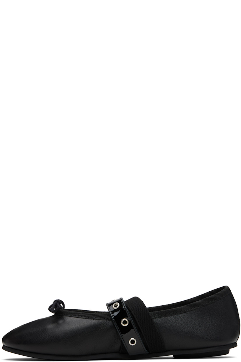 Buffed and patent leather ballerina flats.

· Bow accent and grosgrain trim at collar
· Pin-buckle and elasticized crisscrossing straps at vamp
· Cotton twill lining
· Rubber sole

Supplier color: Black