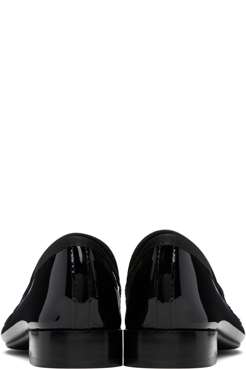 Patent leather loafers.

· Strap at vamp
· Grosgrain trim at tongue and collar
· Knit lining
· Stacked leather heel with rubber injection
· Treaded rubber sole
· Heel: H1"

Supplier color: Black