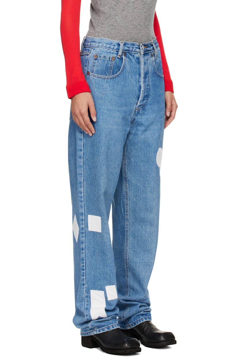 Non-stretch denim jeans.

· Fading and whiskering throughout
· Belt loops
· Five-pocket styling
· Button fly
· Hand-stitched leather graphic patches at legs

Each item is unique. Please note finishings may vary.

Supplier color: Blue/White