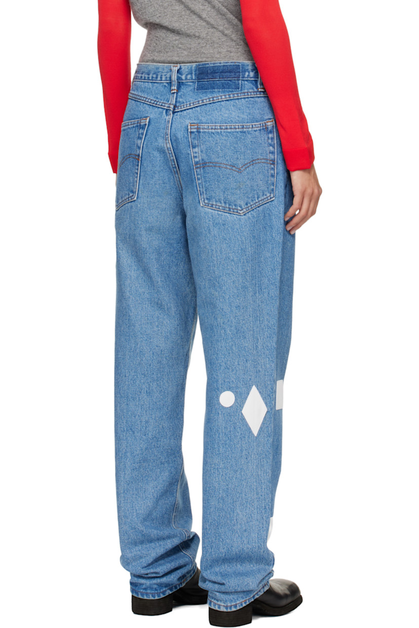 Non-stretch denim jeans.

· Fading and whiskering throughout
· Belt loops
· Five-pocket styling
· Button fly
· Hand-stitched leather graphic patches at legs

Each item is unique. Please note finishings may vary.

Supplier color: Blue/White