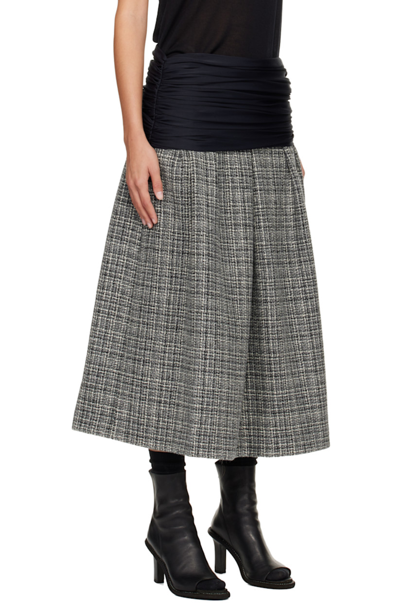 Wool tweed midi skirt.

· Check pattern throughout
· Draping at elasticized foldover waistband
· Ruching at side seams
· Hook-eye and zip closure at side seam
· Full satin lining

Supplier color: Tweed