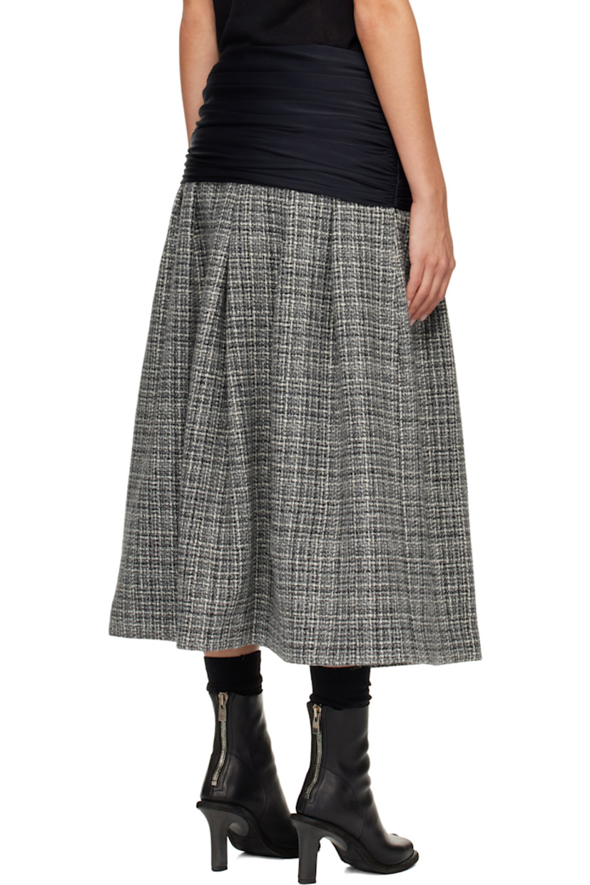 Wool tweed midi skirt.

· Check pattern throughout
· Draping at elasticized foldover waistband
· Ruching at side seams
· Hook-eye and zip closure at side seam
· Full satin lining

Supplier color: Tweed