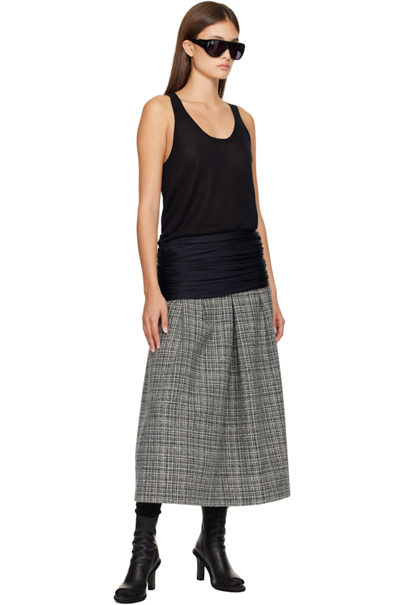 Wool tweed midi skirt.

· Check pattern throughout
· Draping at elasticized foldover waistband
· Ruching at side seams
· Hook-eye and zip closure at side seam
· Full satin lining

Supplier color: Tweed