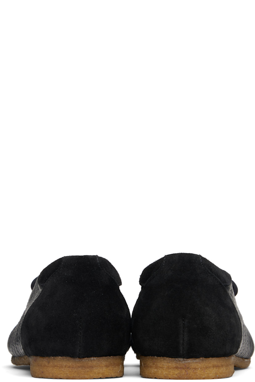 Low-top grained leather and suede sneakers.

· Lace-up closure
· Logo patch at padded tongue
· Padded collar
· Topstitching at sides
· Buffed leather lining
· Crêpe-rubber sole

Supplier color: Black/Black