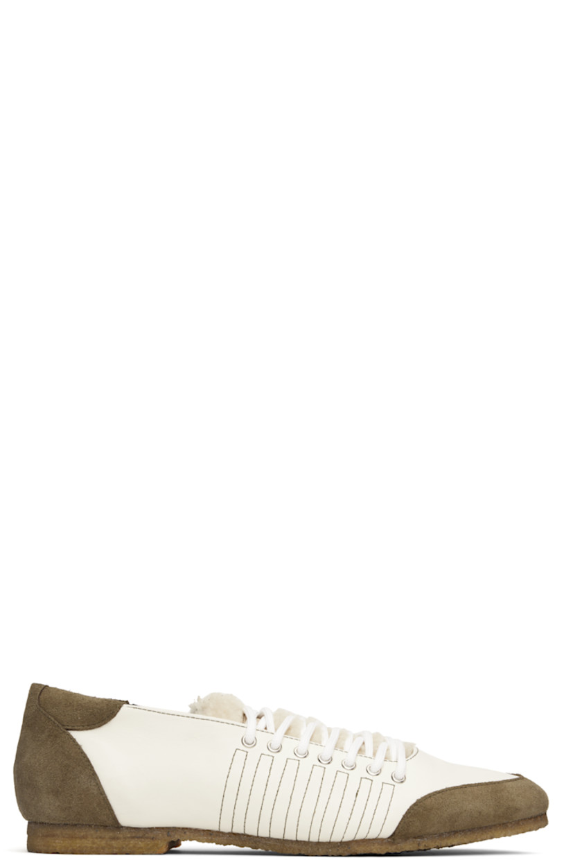 Low-top buffed leather and suede sneakers.

· Lace-up closure
· Logo patch at padded shearling tongue
· Padded collar
· Buffed leather lining
· Crêpe-rubber sole

Supplier color: White/White