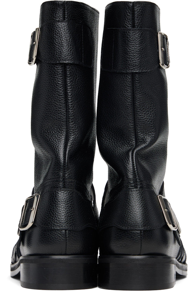 Mid-calf pebble-grained leather boots.

· Graphic appliqués at vamp
· Pin-buckle straps at outer side and collar
· Buffed leather lining
· Stacked leather heel with rubber injection
· Leather sole

Supplier color: Black