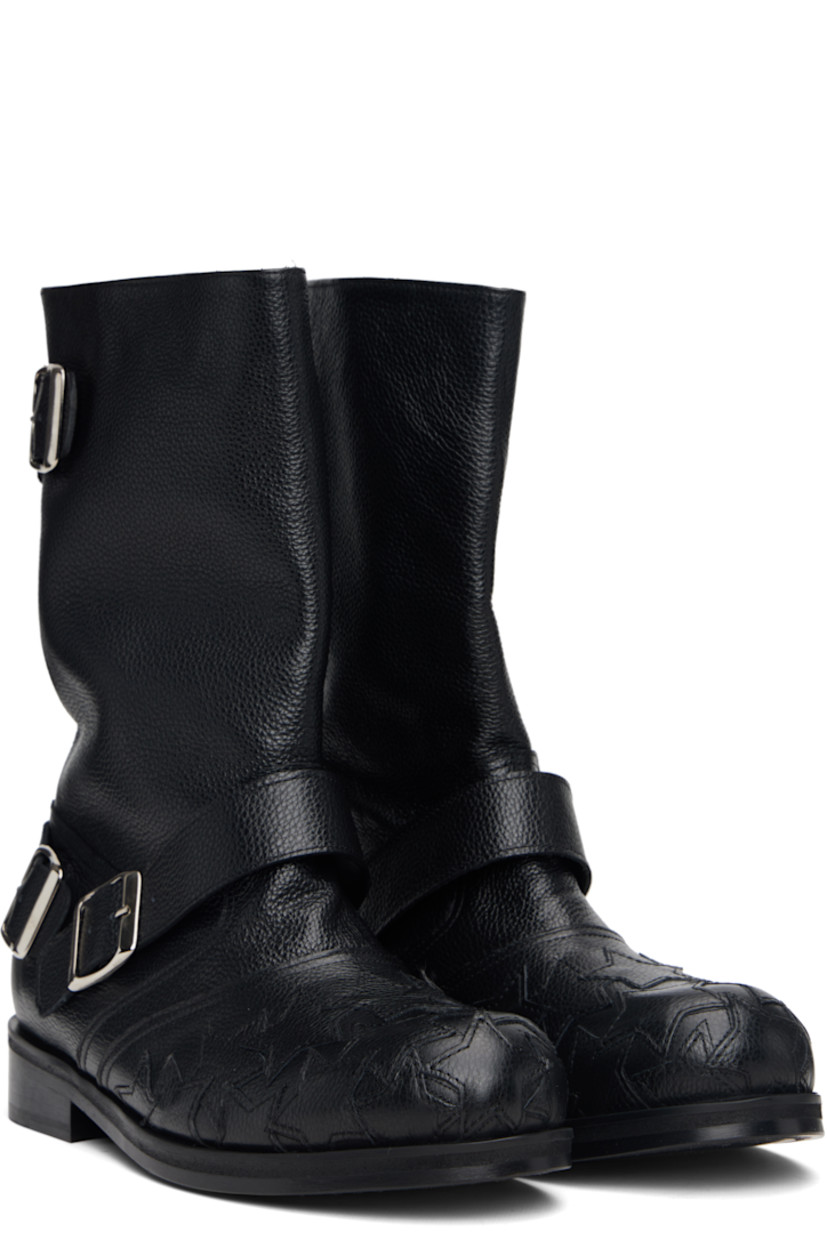 Mid-calf pebble-grained leather boots.

· Graphic appliqués at vamp
· Pin-buckle straps at outer side and collar
· Buffed leather lining
· Stacked leather heel with rubber injection
· Leather sole

Supplier color: Black
