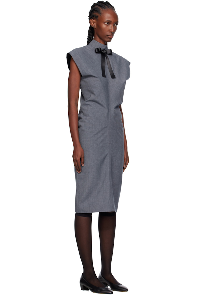 Wool-blend delaine midi dress.

· Detachable bow at stand collar
· Cap sleeves
· Zip closure at back
· Central vent at back hem
· Full satin lining

Supplier color: Grey