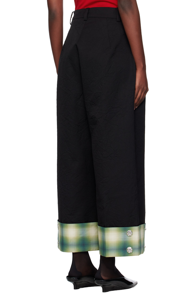 Crinkled wool twill trousers.

· Belt loops
· Two-pocket styling
· Zip fly
· Pleats at front
· Creased legs
· Press-stud fastenings and check pattern at rolled cuffs

Supplier color: Black