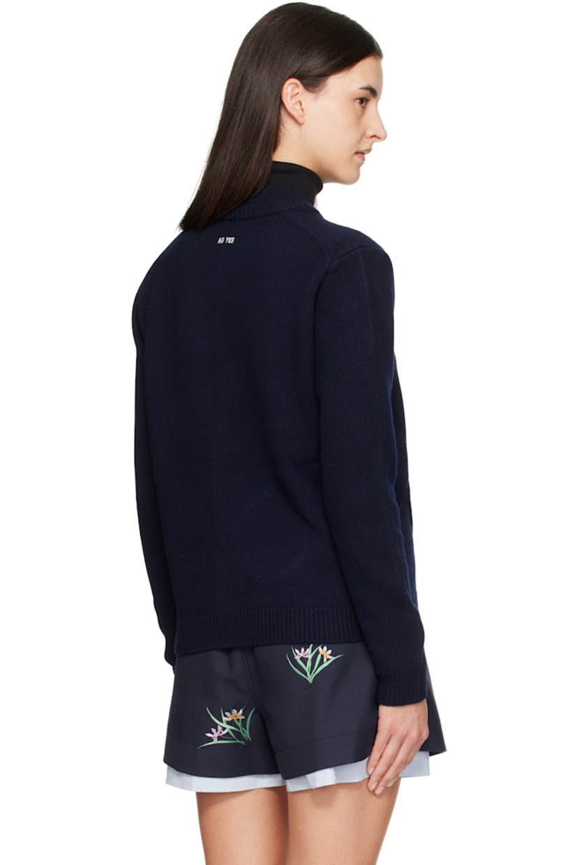 Brushed knit wool cardigan.

· Layered rib-knit round neck
· Concealed press-stud closure
· Detachable satin bow at top button
· Patch pockets at waist
· Rib-knit hem and cuffs
· Embroidered logo at back collar

Supplier color: Navy