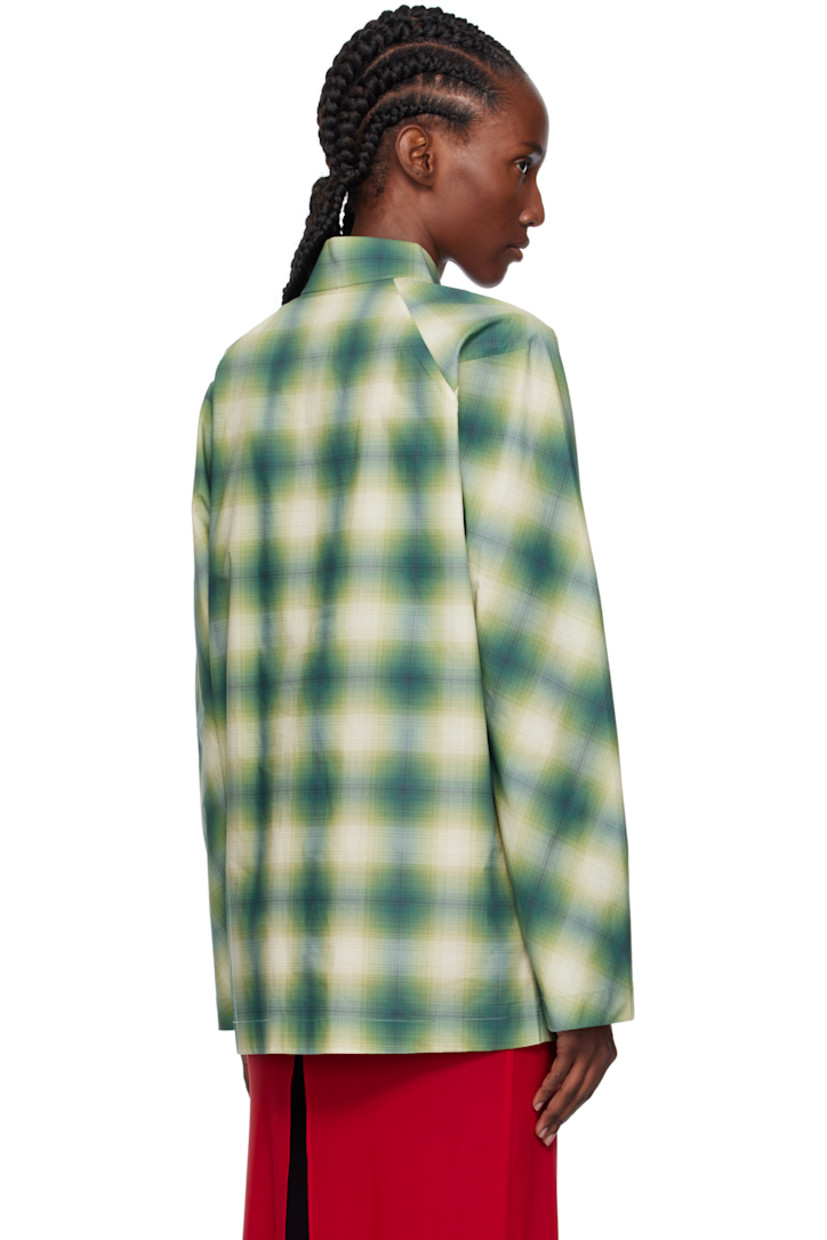 Cotton poplin shirt.

· Check pattern throughout
· Stand collar
· Self-tie closure with press-stud placket
· Logo patch at chest
· Patch pockets at front

Supplier color: Check