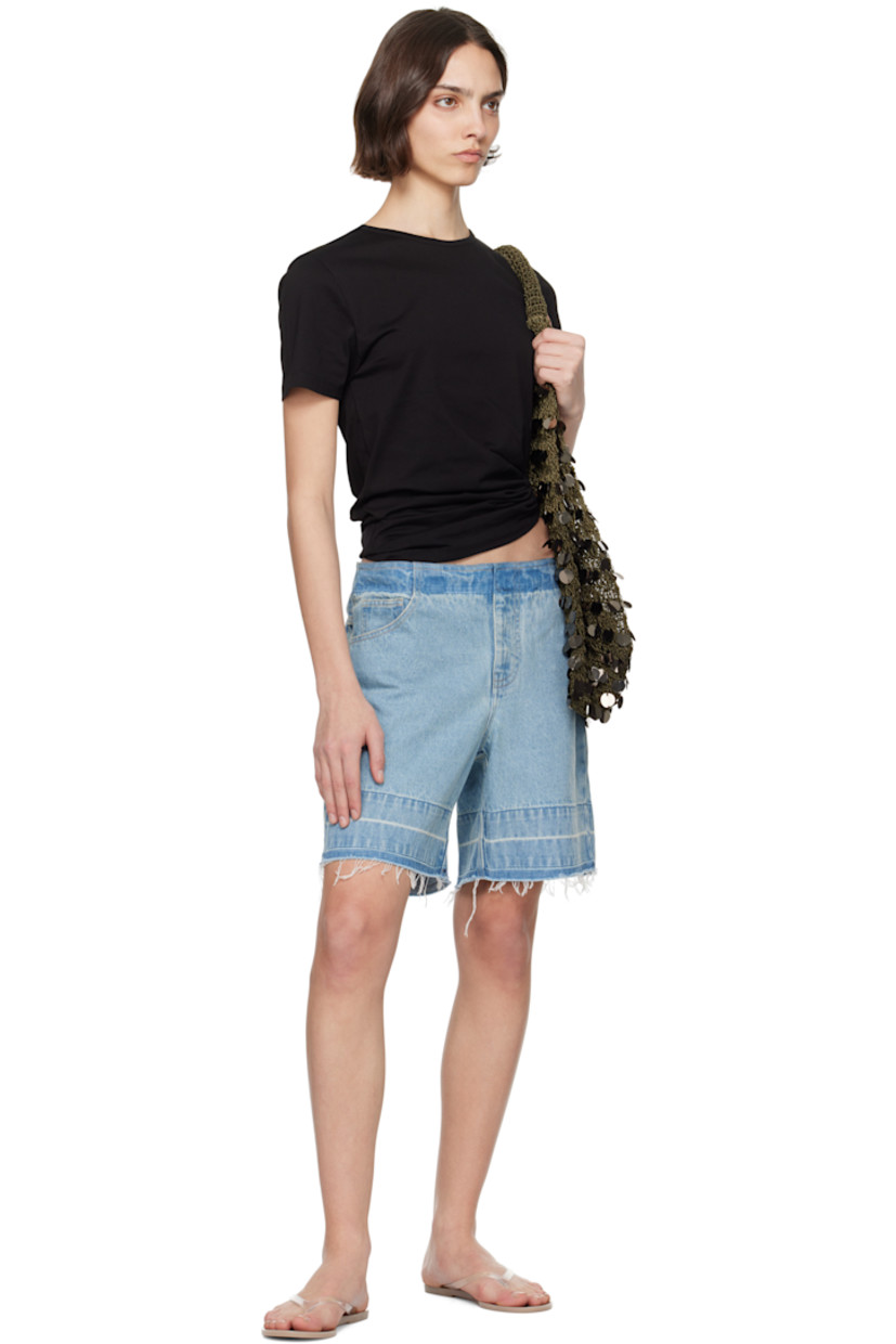 Wide-leg non-stretch denim shorts. Fading throughout.

· Mid-rise
· Five-pocket styling
· Zip fly
· Frayed edge at cuffs
· Contrast stitching in tan

Supplier color: Indigo