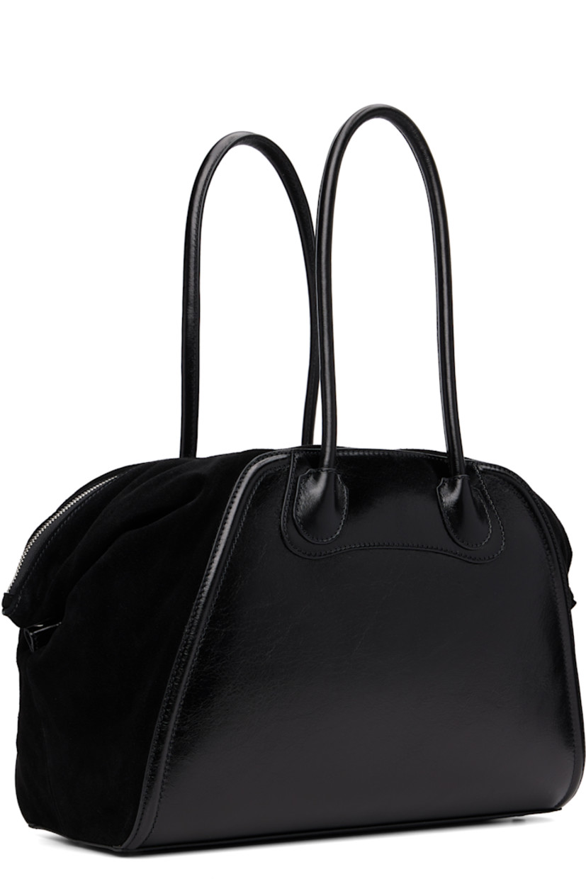 Grained leather and suede carryall tote.

· Twin rolled carry handles
· Logo hardware at face
· Press-stud tab at sides
· Bumper studs at base
· Two-way zip closure
· Zip and patch pockets at interior
· Twill lining
· H11" x W15" x D5.5"

Supplier color: Black