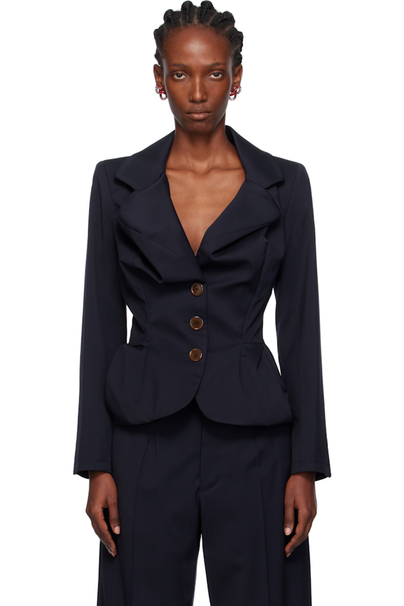 Virgin wool serge blazer. 

· Asymmetrical construction
· Draping throughout 
· Modified notched lapel
· Button closure
· Welt pockets at waist 
· Buttoned surgeon's cuffs
· Central vent at back hem 
· Logo-woven twill lining

Supplier color: Navy