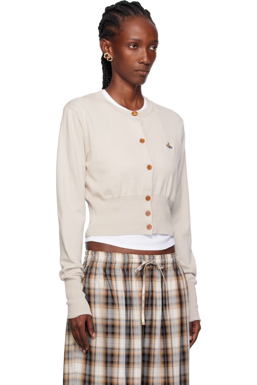 Knit organic cotton- and cashmere-blend cardigan. 

· Rib-knit crewneck, hem, and cuffs
· Button closure
· Embroidered logo at chest
· Cropped hem 

Supplier color: Dusty white