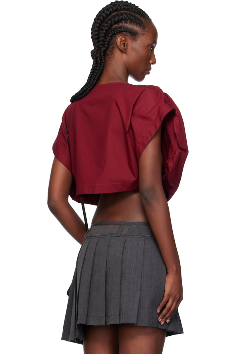 Regenerative cotton poplin blouse. 

· Sweetheart neck
· Embroidered logo at chest
· Curved hem

Supplier color: Carmine