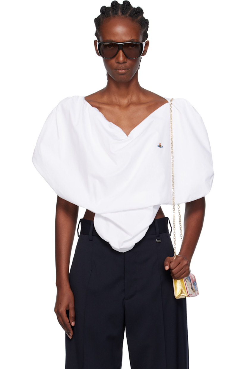 Regenerative cotton poplin blouse. 

· Sweetheart neck
· Embroidered logo at chest
· Curved hem

Supplier color: White